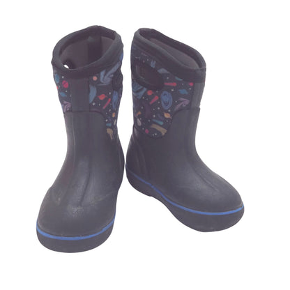 A pair of black waterproof boots with a colorful space-themed print on the side panels and a thin blue stripe along the sole, shown against a plain white background.
