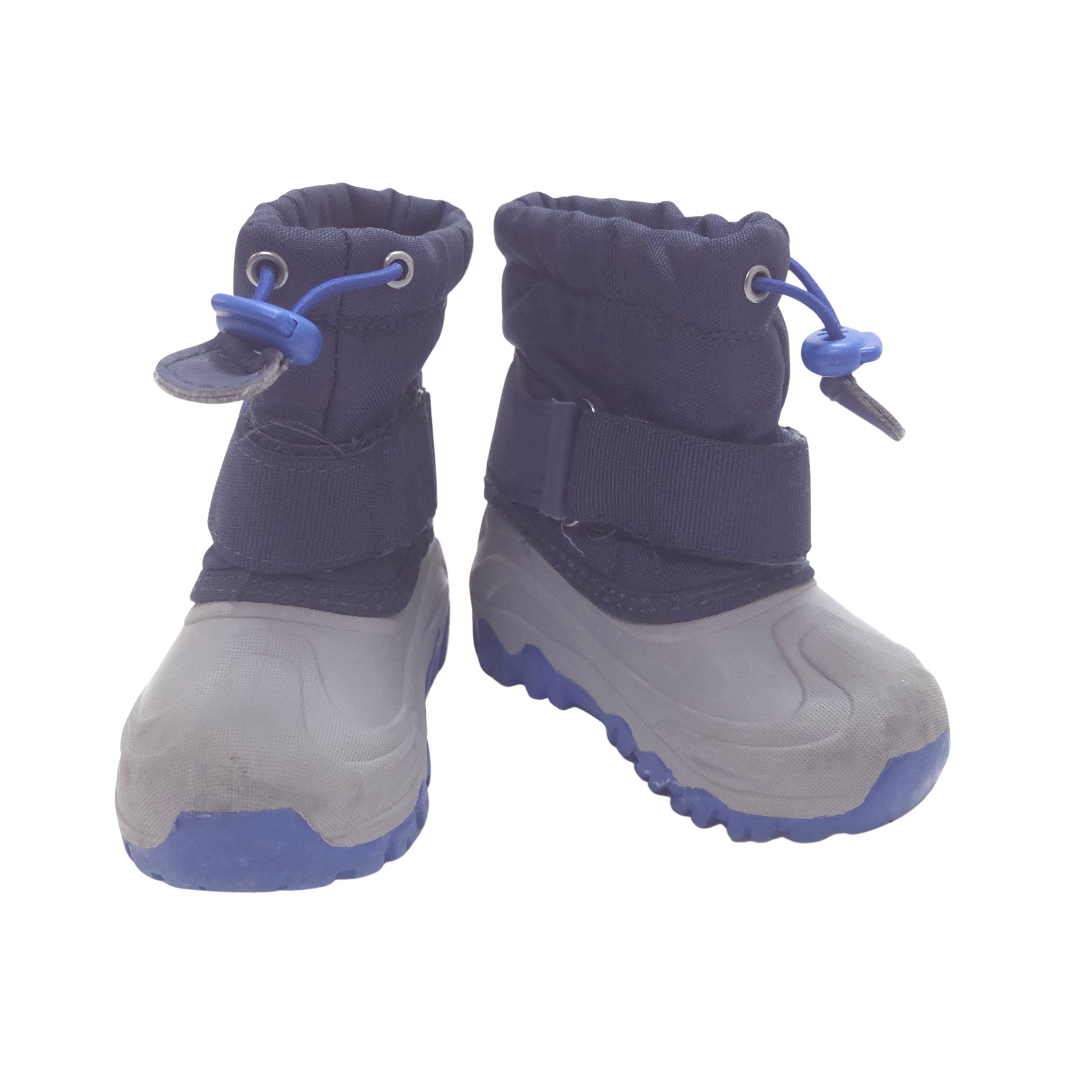 A pair of children's winter boots with navy blue fabric uppers and light gray rubber soles, shown against a plain white background.