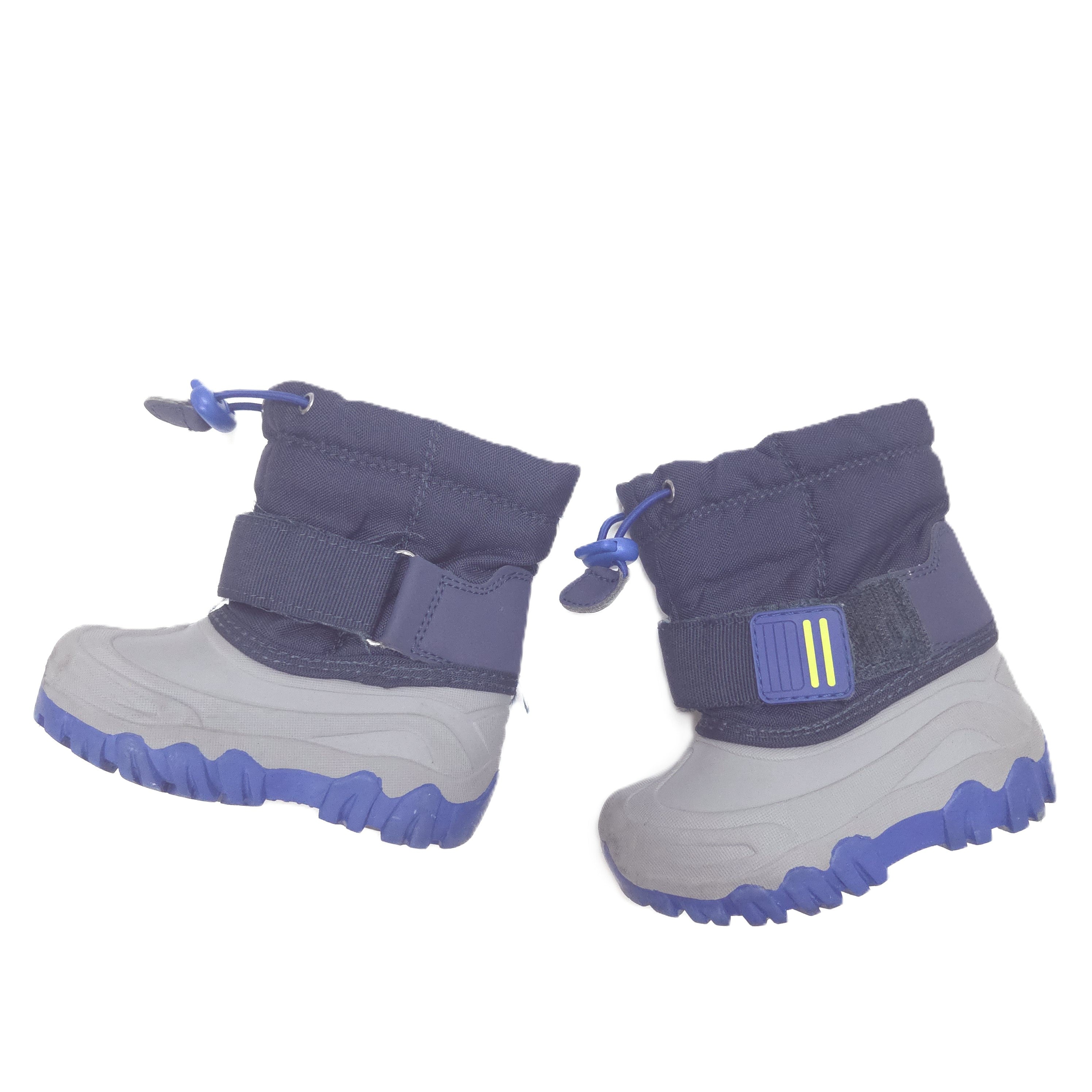 A pair of children's winter boots in gray and blue, featuring hook-and-loop strap closures and textured rubber soles, shown against a plain white background.