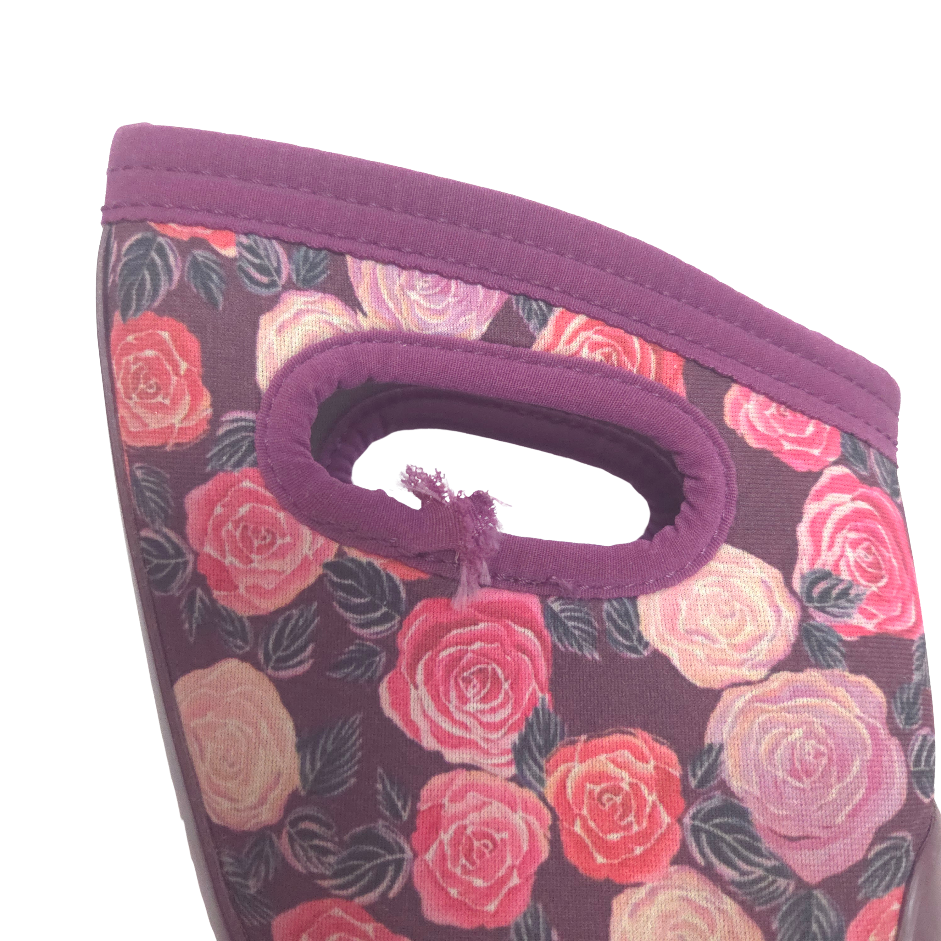 Close-up of a floral boots with a purple handle and trim, featuring a pattern of pink, red, and peach roses on a dark purple background.