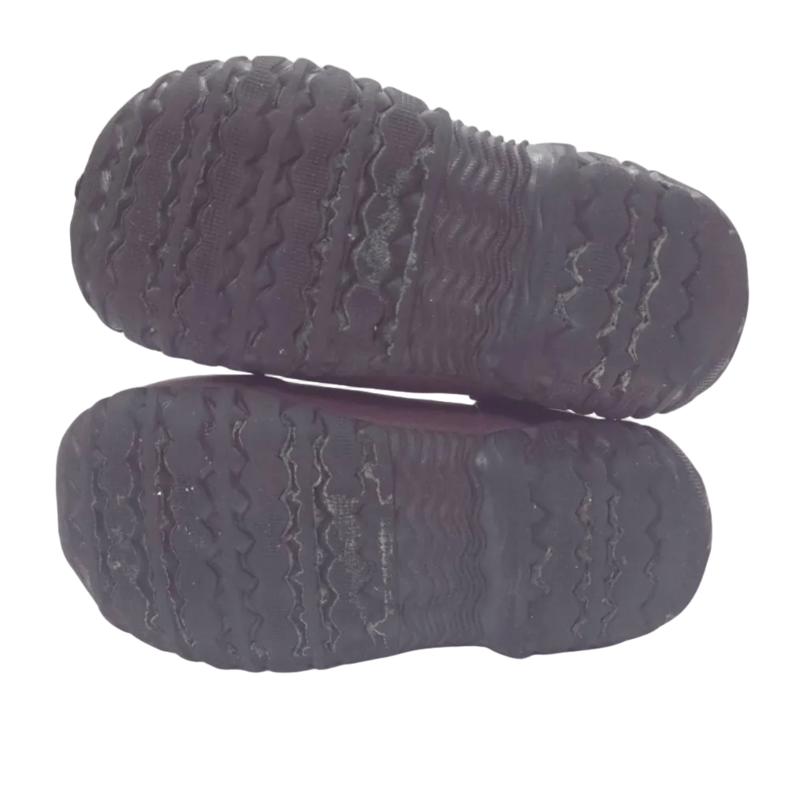 A pair of black rubber shoe soles shown from the bottom, stacked vertically against a plain white background.