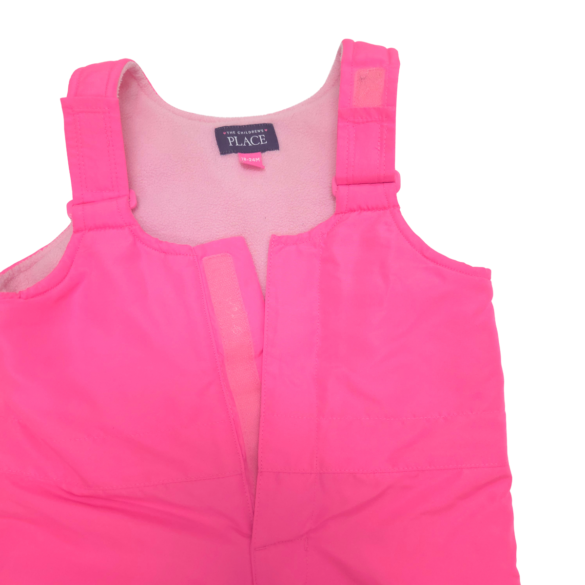 Bright pink, insulated snow bibs featuring adjustable shoulder straps and a hook-and-loop front closure.