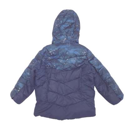 A hooded puffer jacket shown from the back, featuring a solid dark blue body with a lighter blue and white snow-camouflage pattern across the hood, shoulders, and sleeves, set against a plain white background.