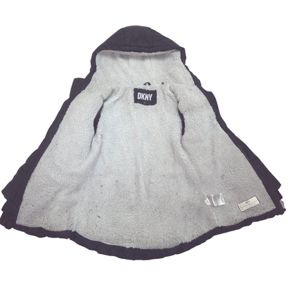 A DKNY hooded winter jacket shown flat against a white background, featuring a light gray sherpa lining.