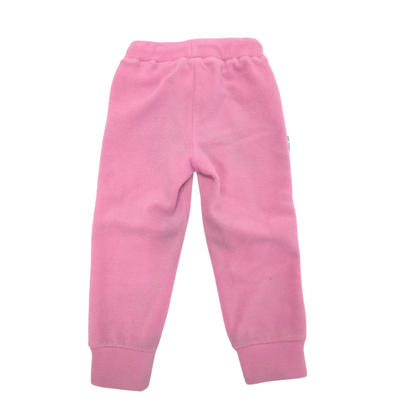 Pink fleece jogger pants for toddlers, featuring an elastic waistband and ribbed ankle cuffs, shown flat on a white background.