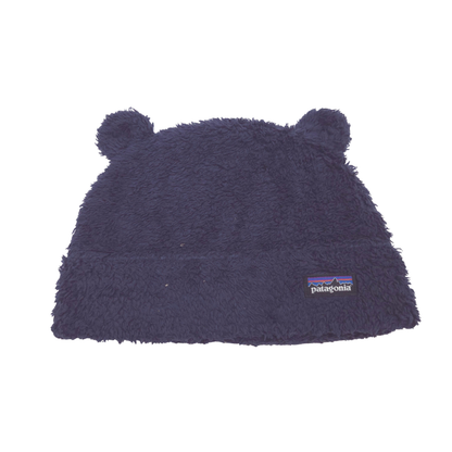 A dark navy blue Patagonia fleece beanie hat with small bear ears on top and the signature Patagonia logo patch on the front, shown against a plain white background.