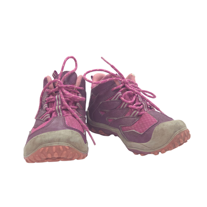 A pair of kids's mid-height hiking shoes in purple and pink, featuring pink laces, a textured purple upper, and a beige suede-like toe box and midsole.