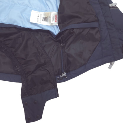 Close-up of a dark navy winter jacket showing the interior lining, a light blue inner layer, a zipper, and a sewn-in temperature strip label.