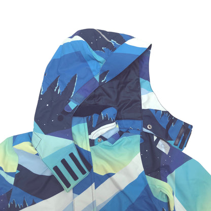 A close-up of a ski jacket hood featuring a colorful geometric mountain and snow pattern in shades of blue, teal, yellow, and white, set against a plain white background.