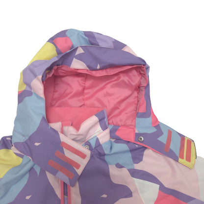 Close-up of a hooded jacket with a colorful abstract geometric pattern in purple, pink, light blue, yellow, and white, showing the hood lining and shoulder strap details against a white background.