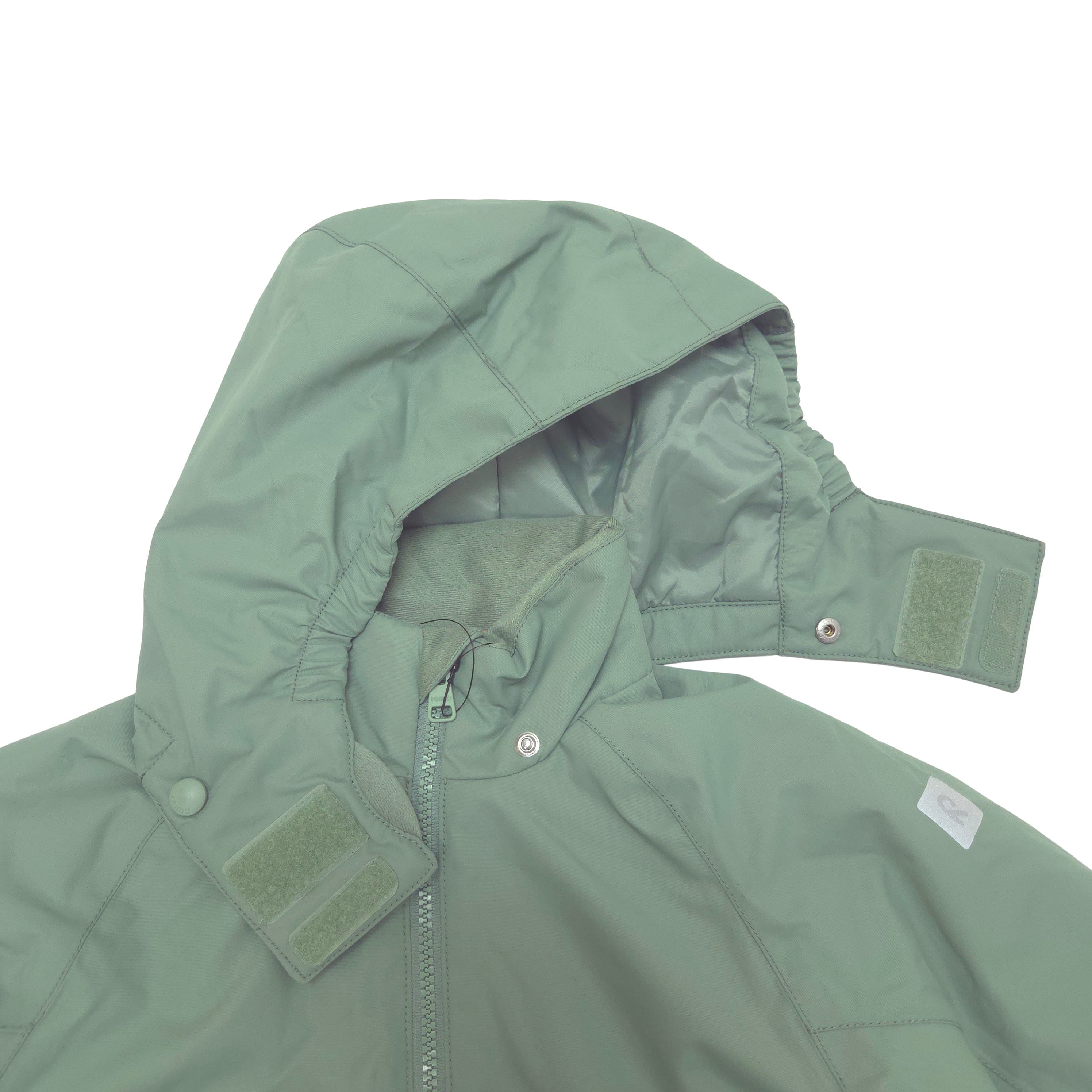 A close-up of a sage green hooded jacket with a front zipper, snap buttons, and hook-and-loop strap details on the hood and collar, shown against a plain white background.