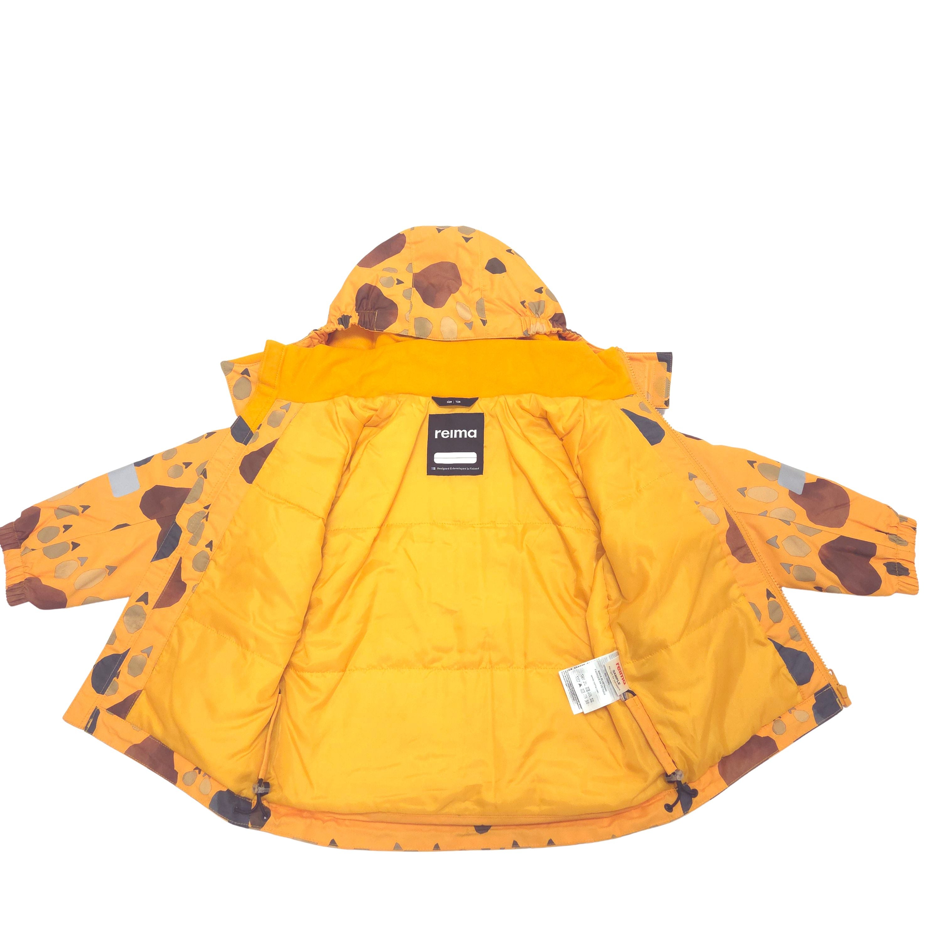 A bright yellow hooded winter jacket with brown, gray, and black animal footprint pattern, shown flat against a white background. 