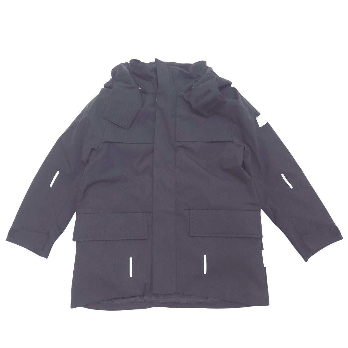 A black hooded jacket with multiple flap pockets and reflective white strip details, laid flat against a white background.