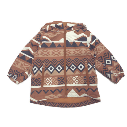 A hooded winter jacket with a brown, beige, and navy geometric pattern, laid flat against a white background.
