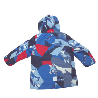 A hooded children's winter jacket shown from the back, featuring a bold geometric patchwork pattern in shades of blue, navy, red, and light gray on a plain white background.
