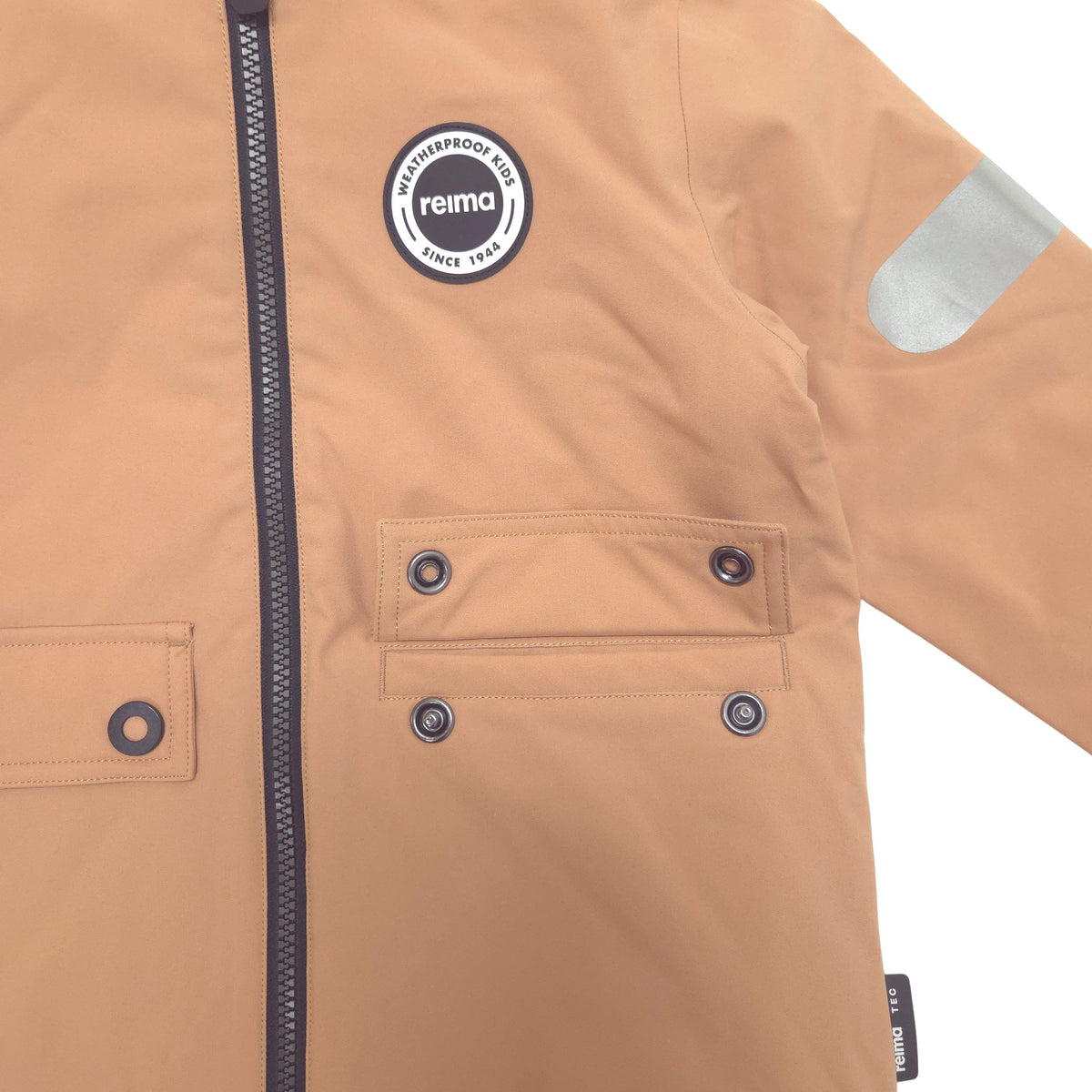 Reflective silver patch on the sleeve and flap pocket with snaps