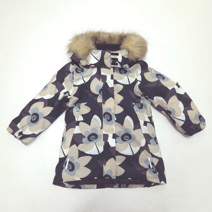 A children's winter parka jacket with a dark brown and beige floral pattern, featuring a faux-fur trimmed hood, laid flat on a white background.