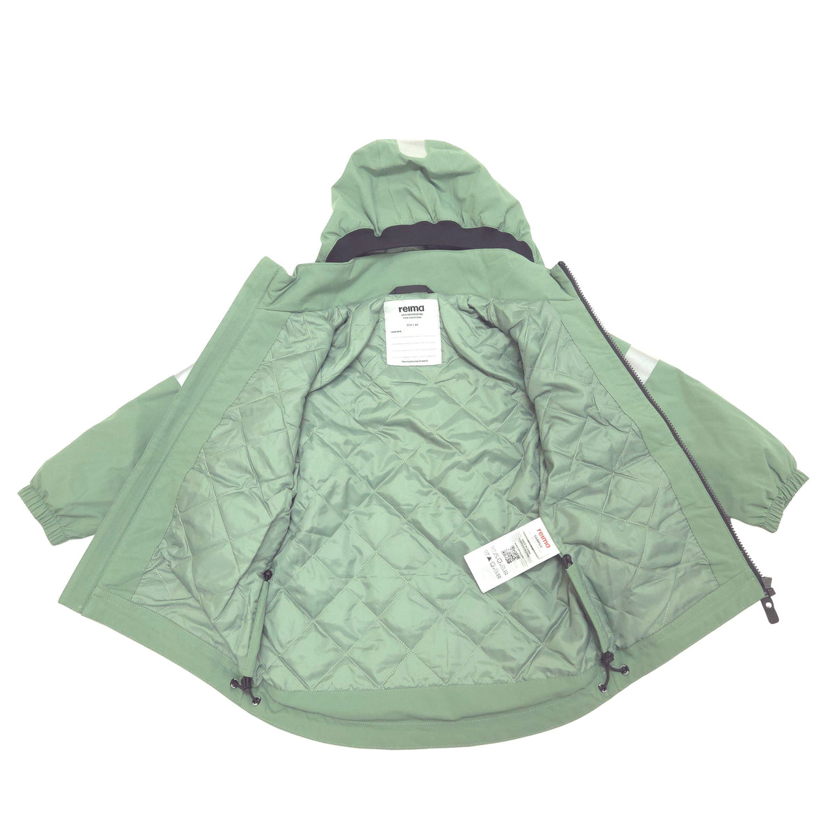 A sage green hooded jacket with a diamond-quilted interior lining, shown open against a plain white background. The brand name 'reima' is visible on the inner neck label, and a white hangtag is attached near the zipper.