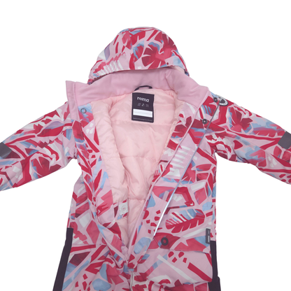 A children's hooded snowsuit, featuring a pink, red, and light blue tropical leaf pattern on the shell, with a soft pink quilted lining.