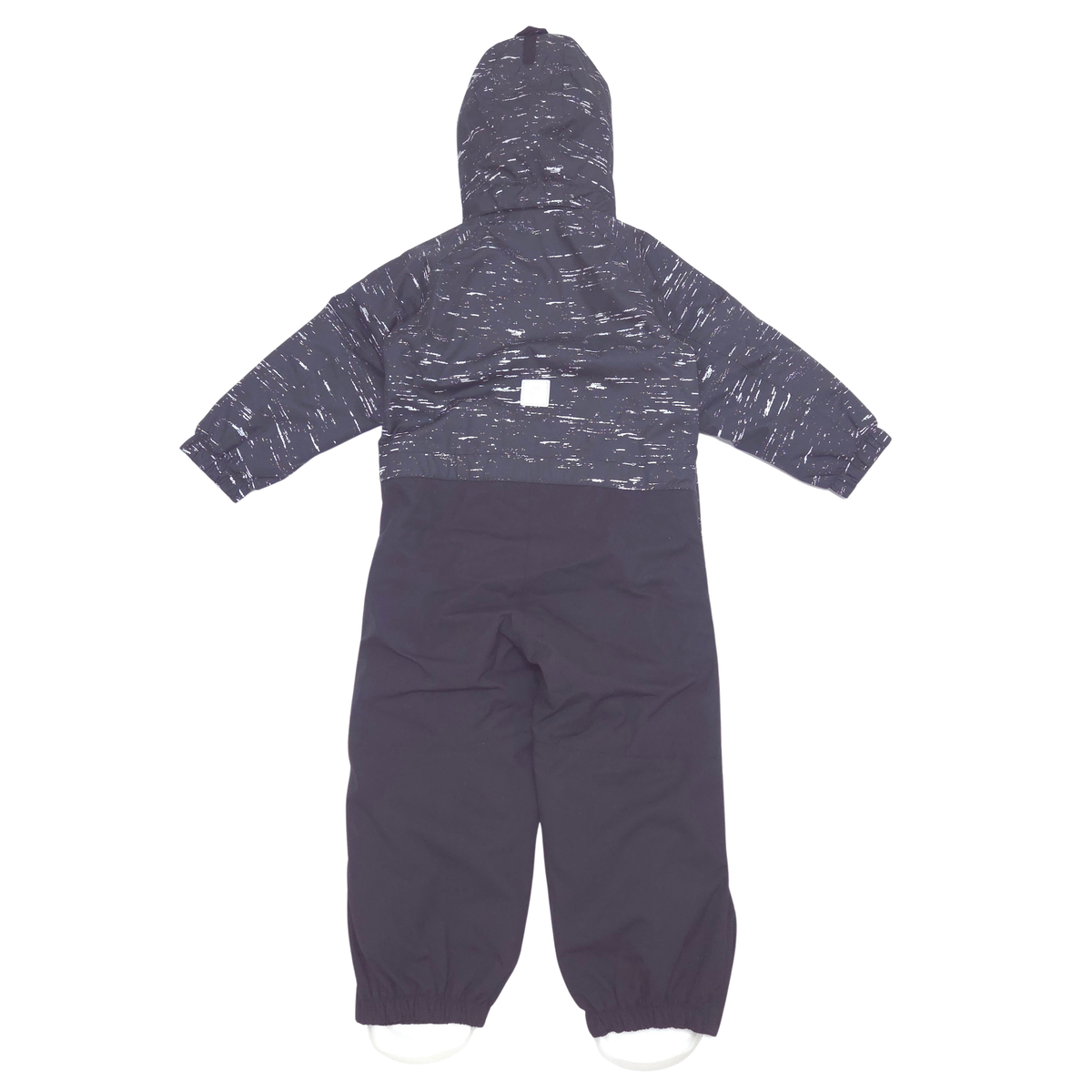 A hooded one-piece snowsuit or jumpsuit in dark charcoal gray with a white speckled pattern across the upper body and sleeves, and solid dark gray lower legs, shown flat against a white background.