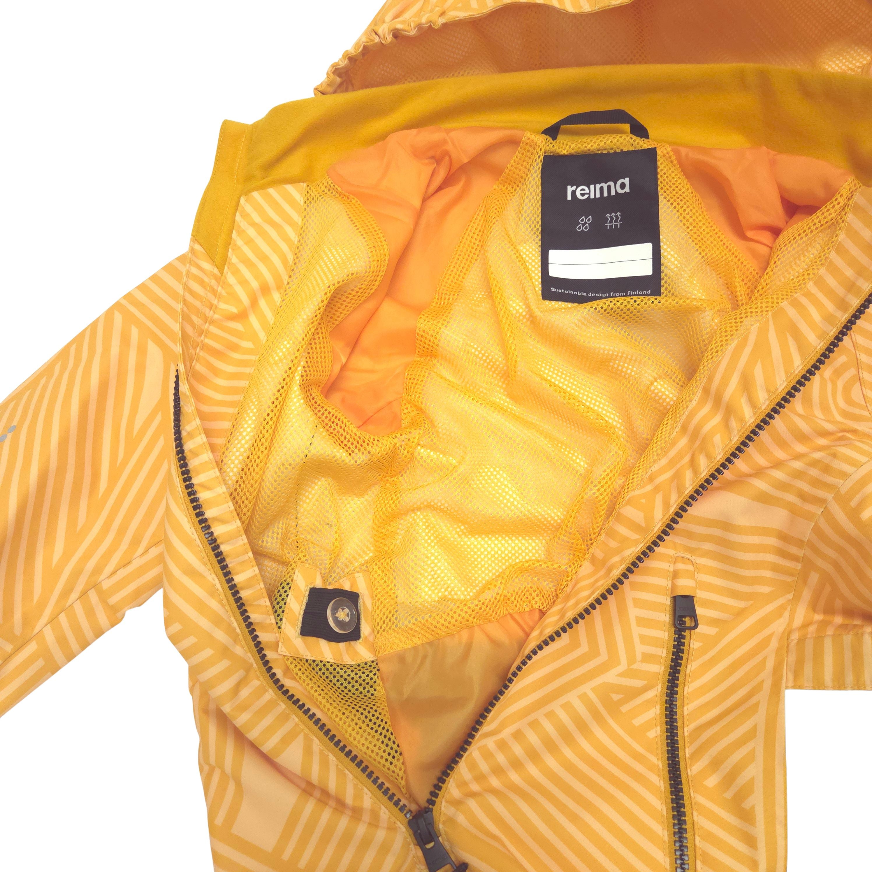 Close-up of a yellow and orange patterned hooded shell suit with a yellow mesh lining and a visible Reima brand label. Integrated waist adjuster with buttons make it easy to fine-tune the fit