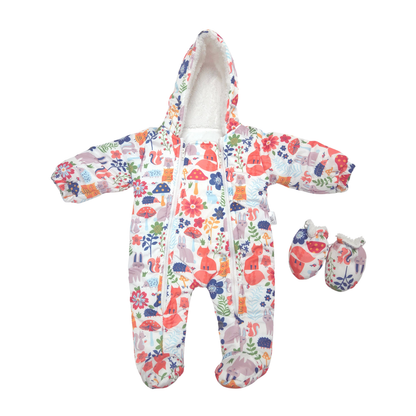 A baby footed one-piece sleeper with a colorful woodland print, shown with a matching pair of booties on a plain white background.