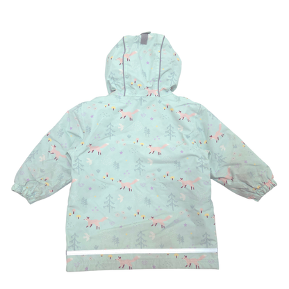 A hooded children's rain jacket in a pale mint green color, featuring an all-over whimsical print of pink foxes, gray trees, and small colorful dots. The jacket is shown flat against a solid white background.