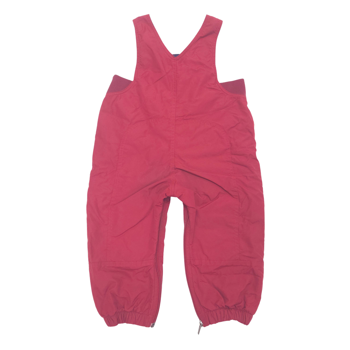 A pair of red bib overalls with elasticized ankle cuffs, laid flat against a solid white background.