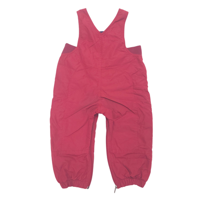 A pair of red bib overalls with elasticized ankle cuffs, laid flat against a solid white background.