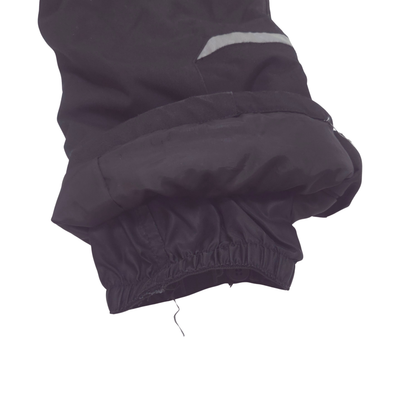 Internal gaiters at cuffs keep out snow; external scuff guards protect from boot- and ski-edge wear.