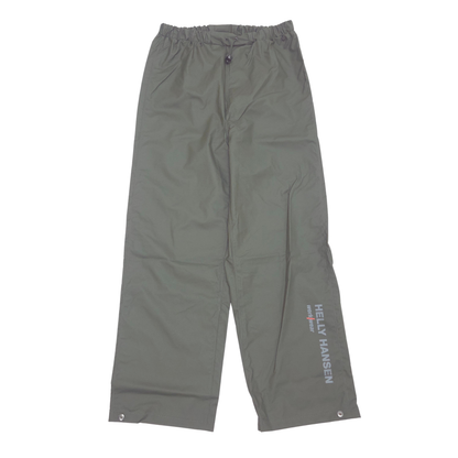 Green waterproof pants with an elastic waistband, side gussets, and vertical 'HELLY HANSEN' branding printed in white on the lower left leg, shown flat on a white background.