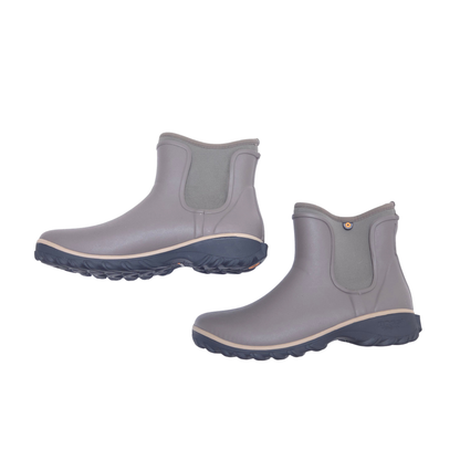 A pair of brown rubber rain boots with elastic side panels and dark gray soles, shown on a plain white background.