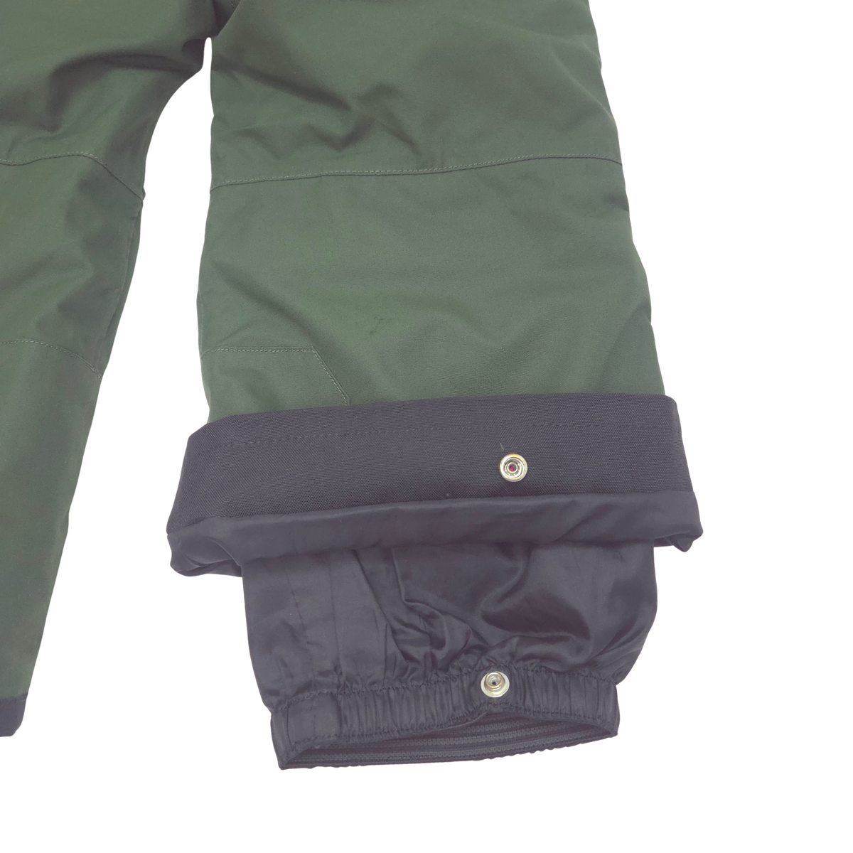Internal gaiters at cuffs keep out snow; external scuff guards protect from boot- and ski-edge wear
