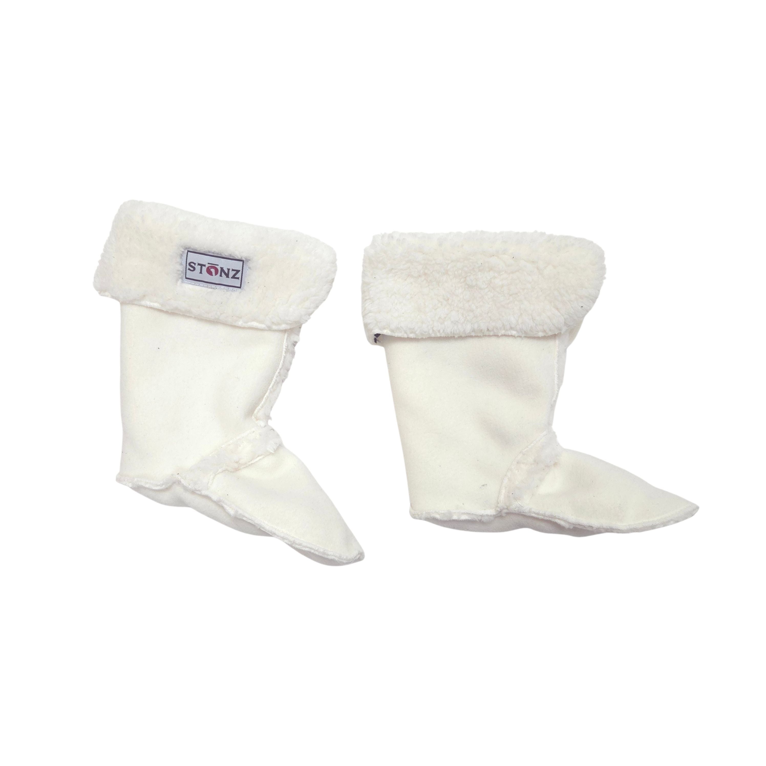 A pair of off-white boot liners with plush cream sherpa cuffs, shown against a plain white background. A small brand label reading 'STONZ' is visible on the left bootie cuff.