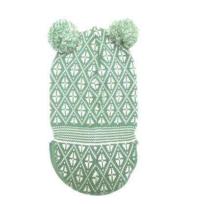 A green and white patterned knit balaclava with two pom-poms on top, shown against a plain white background.