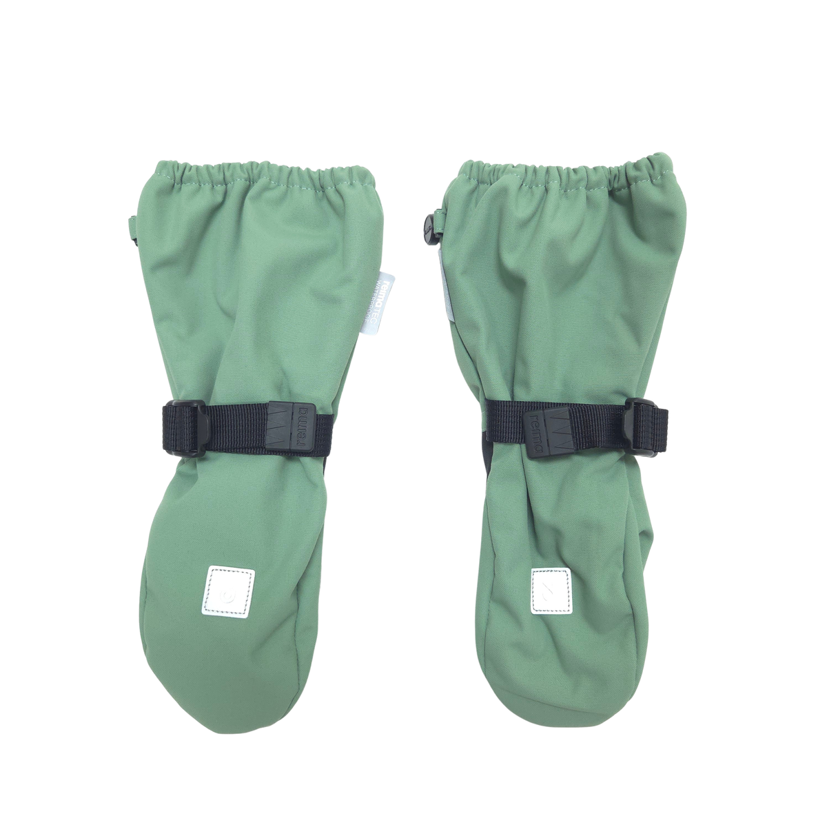 A pair of sage green mittens with black  straps and small white square patches, displayed on a solid white background.