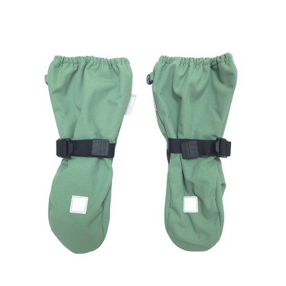 A pair of sage green mittens with black  straps and small white square patches, displayed on a solid white background.