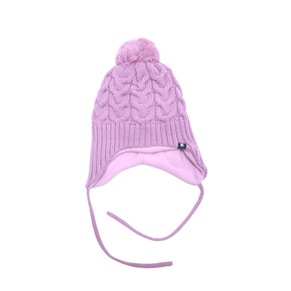 A light pink cable-knit winter hat with a matching pom-pom, ear flaps, and long chin ties, shown against a plain white background.