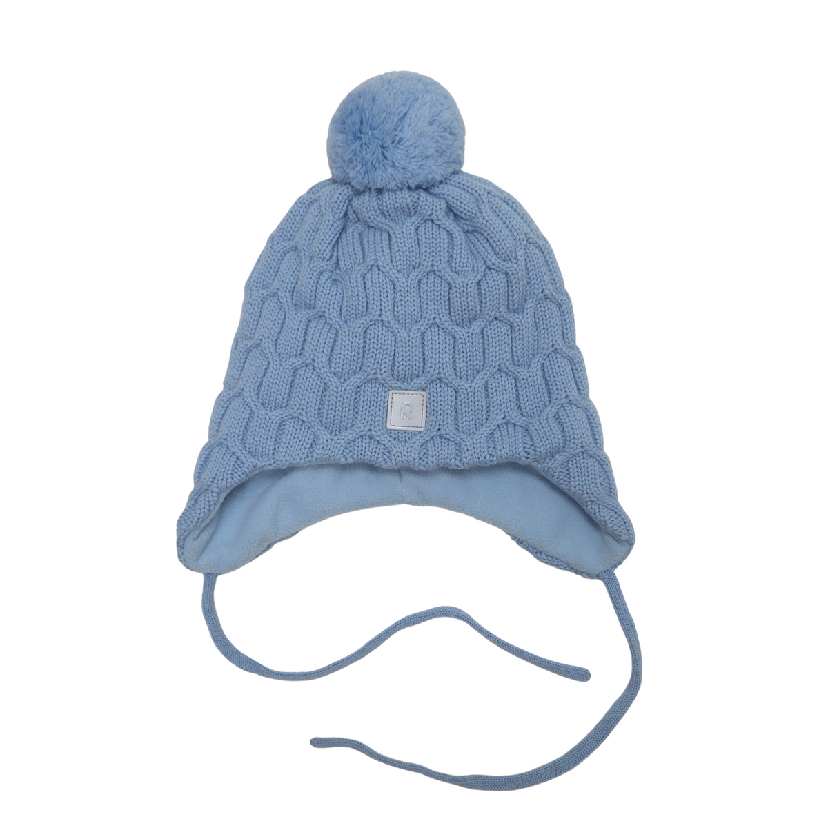 A light blue knit pom-pom beanie hat with ear flaps and long ties, shown against a plain white background.