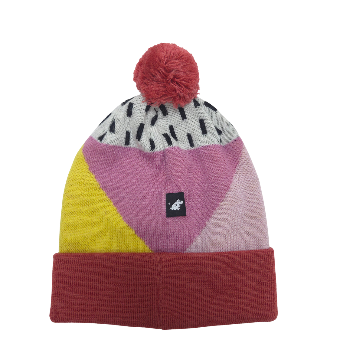 A multicolor knit beanie hat with a red pom-pom on top, featuring geometric color-blocked panels of yellow, pink, and light purple, a gray patterned section with black dashes, and a solid dark red cuff.