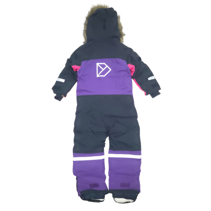 A children's full-body snowsuit shown from the back, featuring a black upper body, a wide purple chest panel with a white geometric logo, and purple lower leg sections with white reflective stripes.