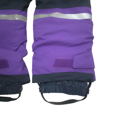 Internal gaiters at cuffs keep out snow; external scuff guards protect from boot- and ski-edge wear
