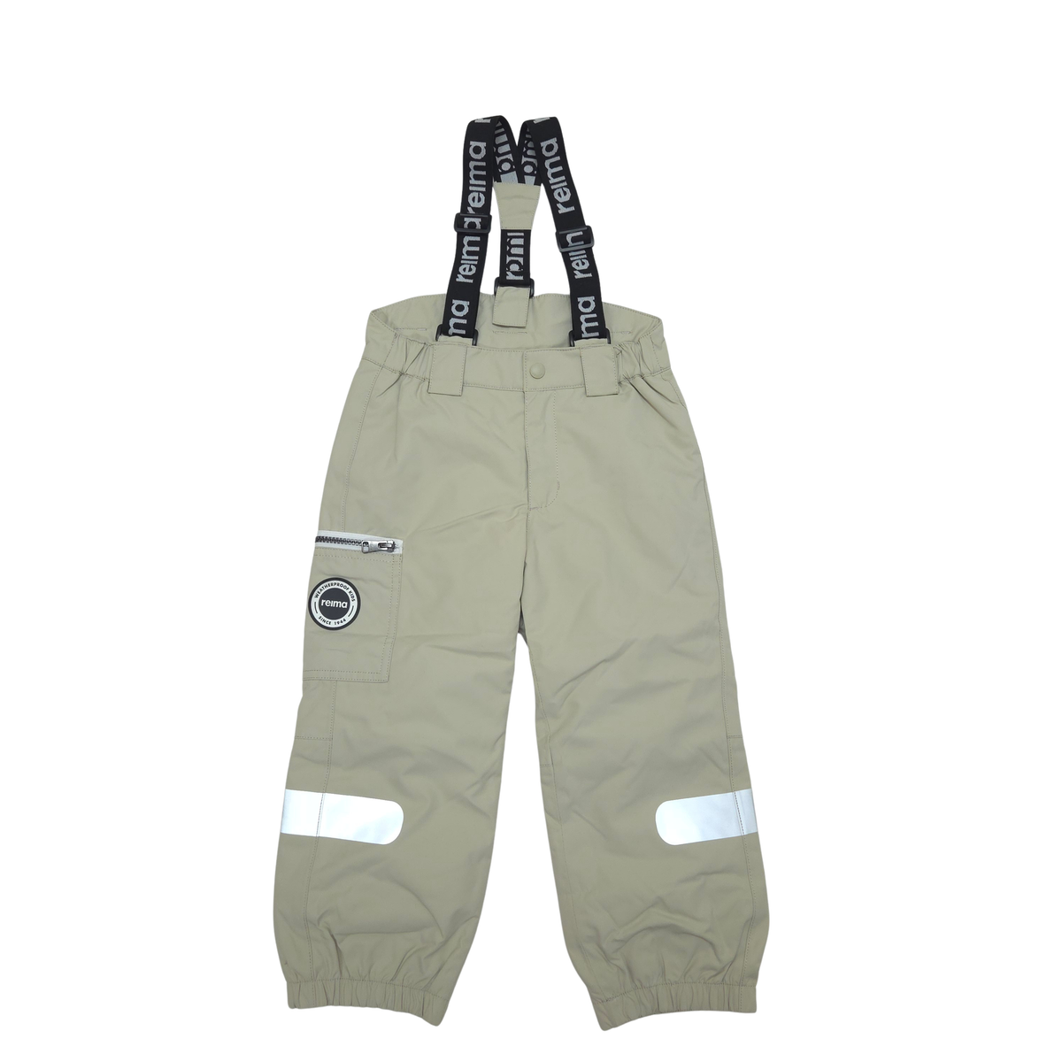 A pair of light beige waterproof bib overalls with black suspenders featuring white text, reflective strips on the legs, and a zippered utility pocket on one leg.