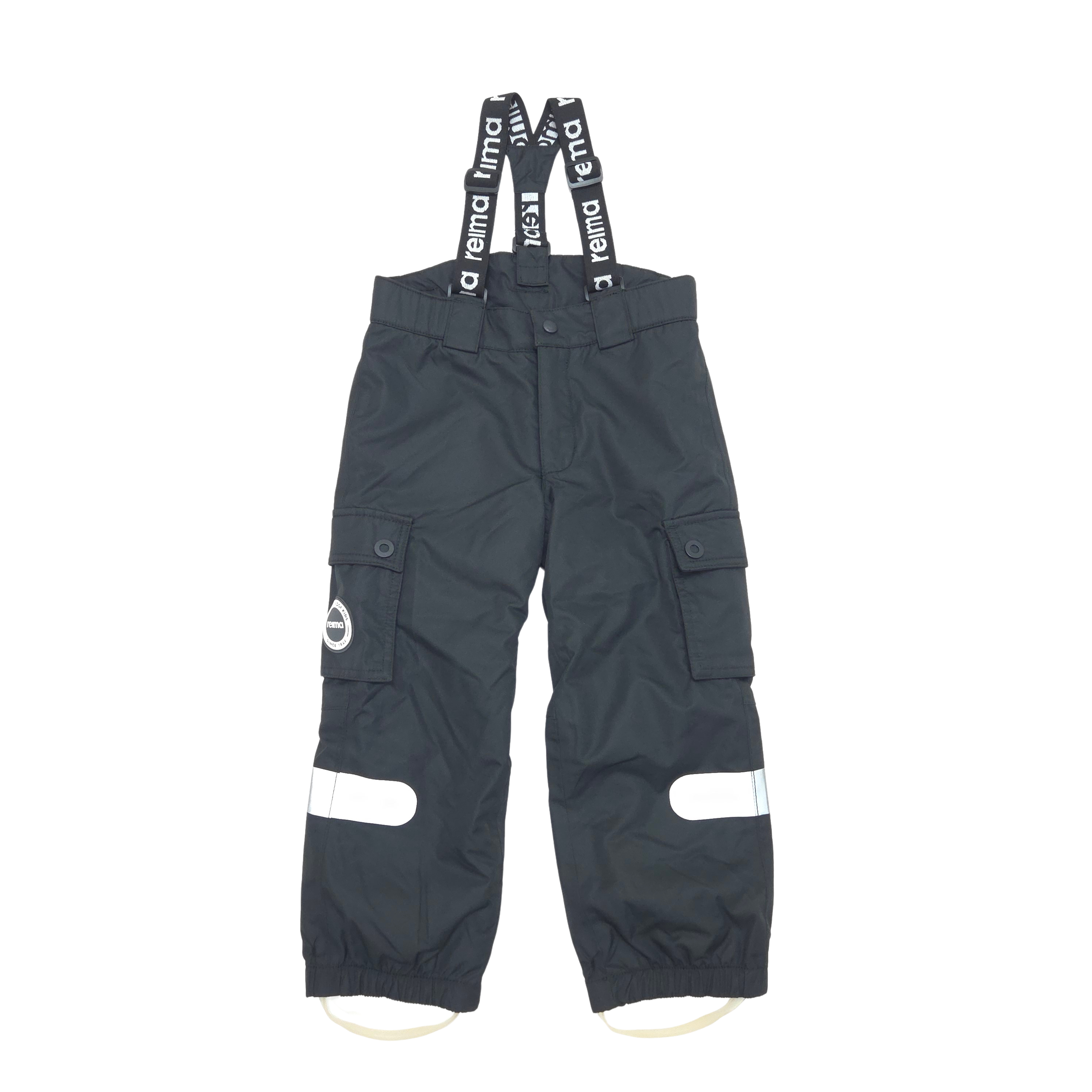 Black waterproof bib pants with white reflective strips on the lower legs and black suspenders printed with 'reima' in white.