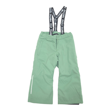 A pair of mint green snow pants with black suspenders featuring the white 'reima' brand name, shown flat on a white background.