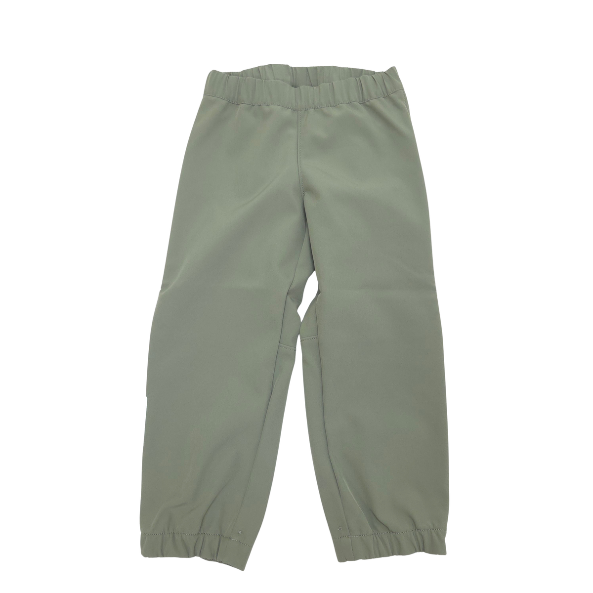 A pair of sage green children's softshell pants with an elastic waistband and elastic ankle cuffs, shown flat on a white background.