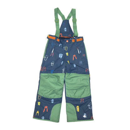 A pair of children's snow bib overalls in navy blue and green, featuring an all-over space-themed print of rockets, spaceships, and astronauts. The bib has green shoulder straps, a matching green waist belt with orange accents, and green reinforced knee patches.