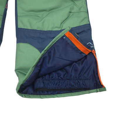 Internal gaiters at cuffs keep out snow; external scuff guards protect from boot- and ski-edge wear

