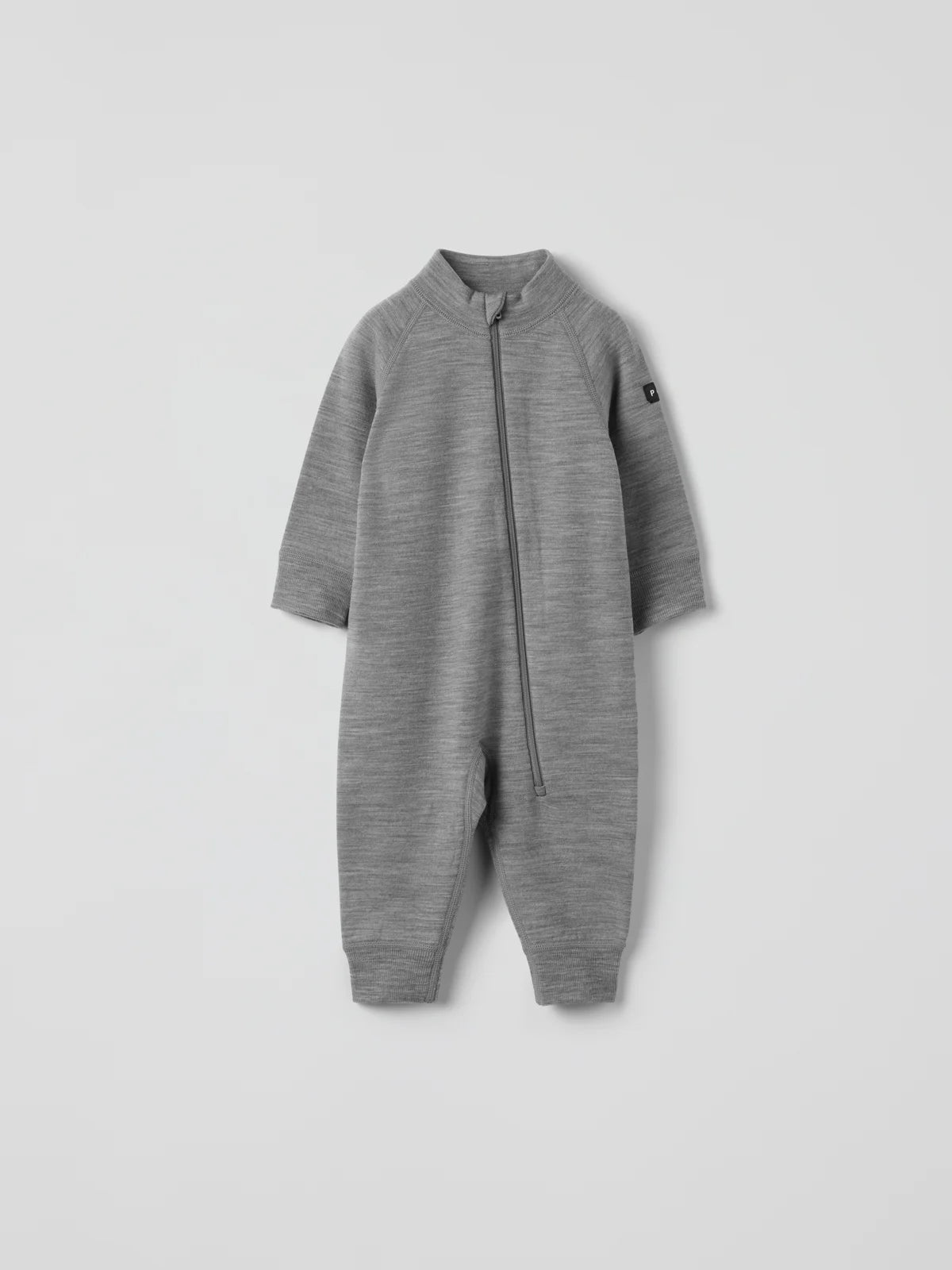 A long-sleeve zip-up merino wool romper in heather gray, featuring a mock neck collar and a small black brand tag on the upper left sleeve, displayed against a light gray background. #color_grey-melange