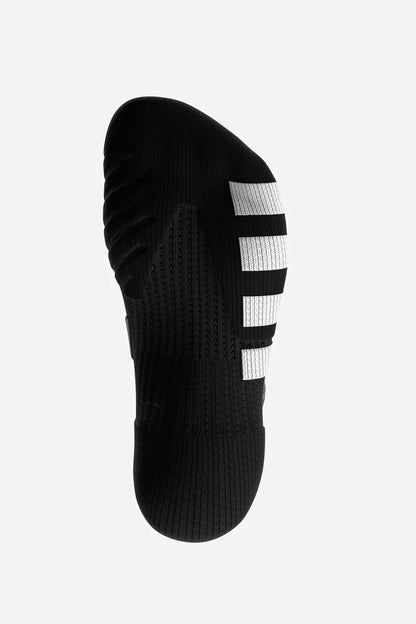 A single black athletic sock shown from the sole view, featuring three white stripes on the heel, on a light gray background.